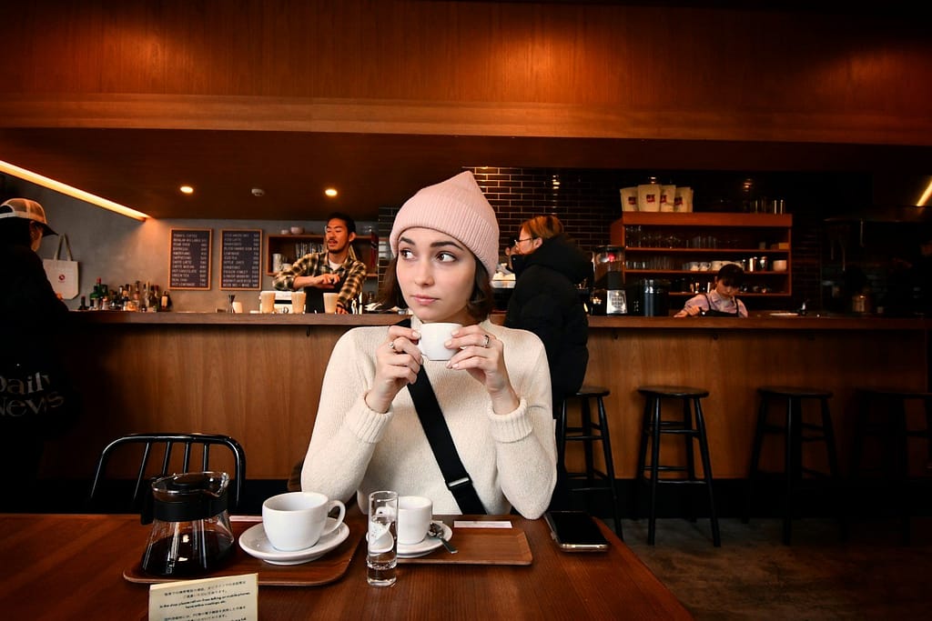Calm woman enjoying morning coffee during her fasting window - intermittent fasting for women